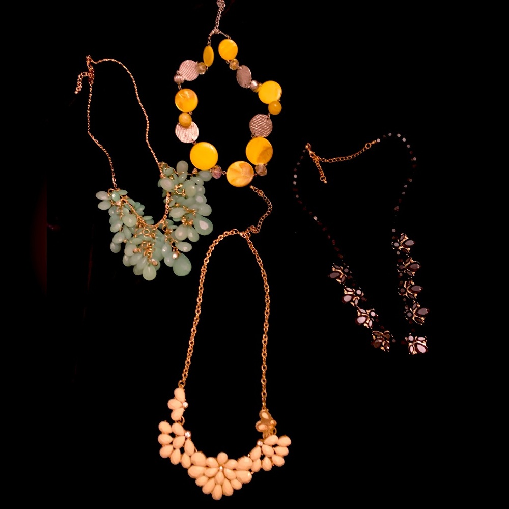 4 costume jewelry necklaces.